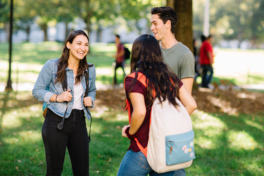 students chatting on campus