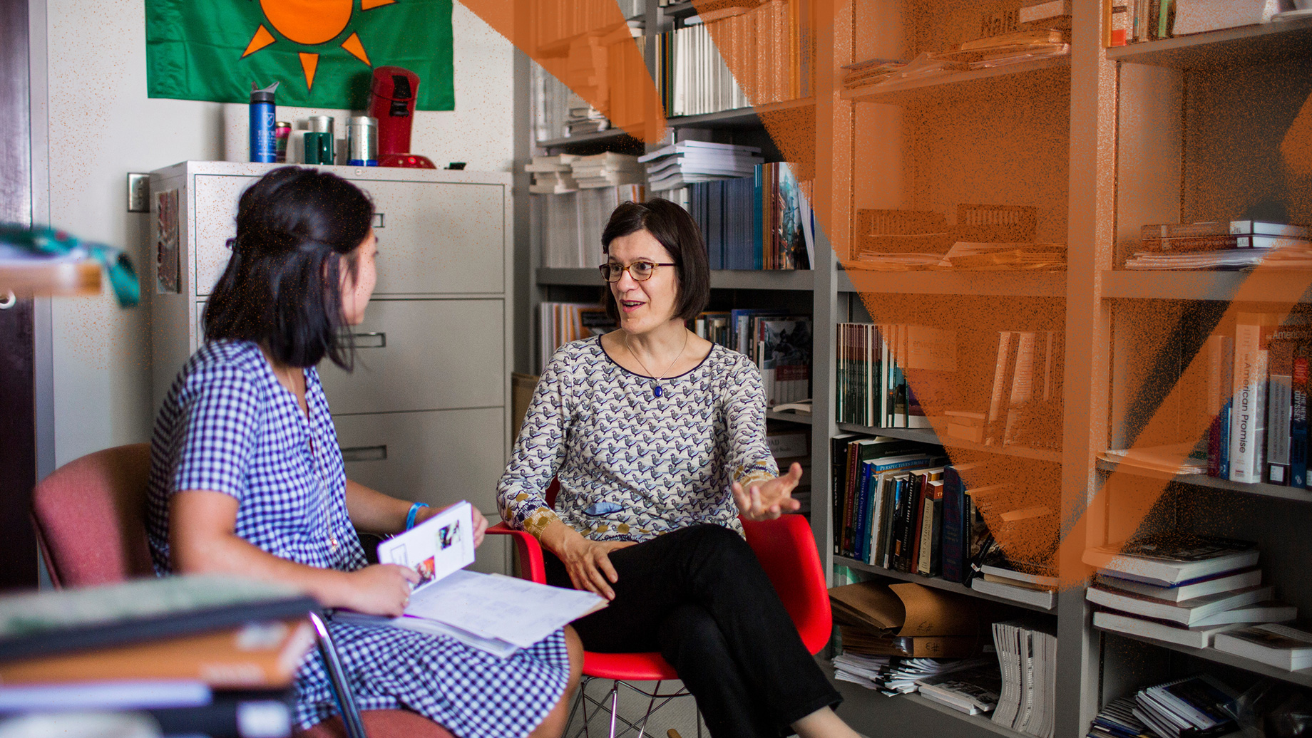 student meets with advisor in her office