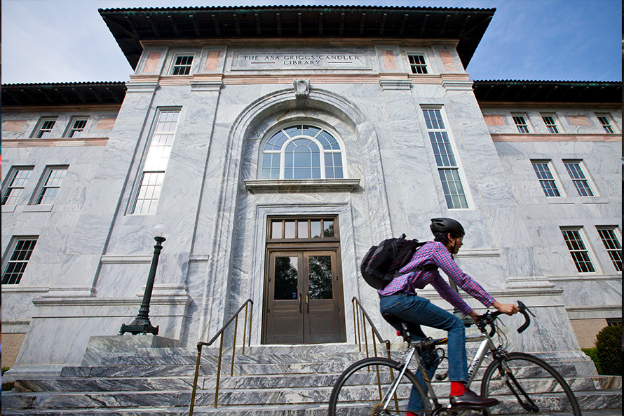 cyclist outside Emorys' Candler Library