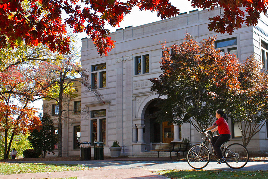 cyclist outside of Oxford's Candler Hall