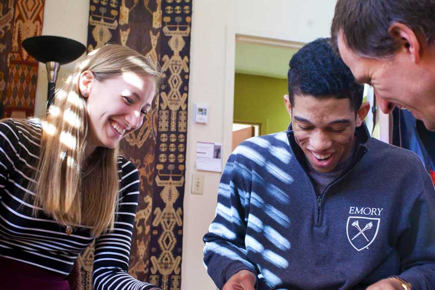 Students parading with Emory pennant