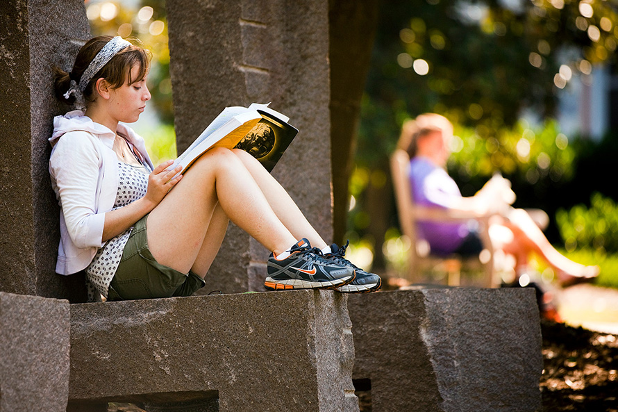 student studying on campus