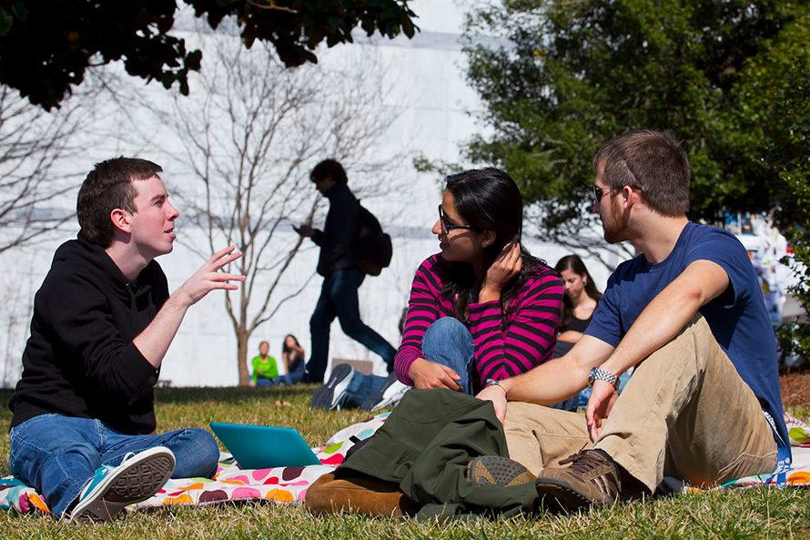 students conversing on campus