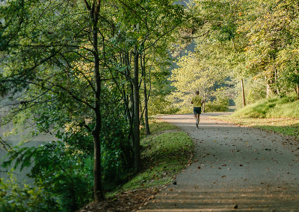 jogger runs through Lullwater Preserve