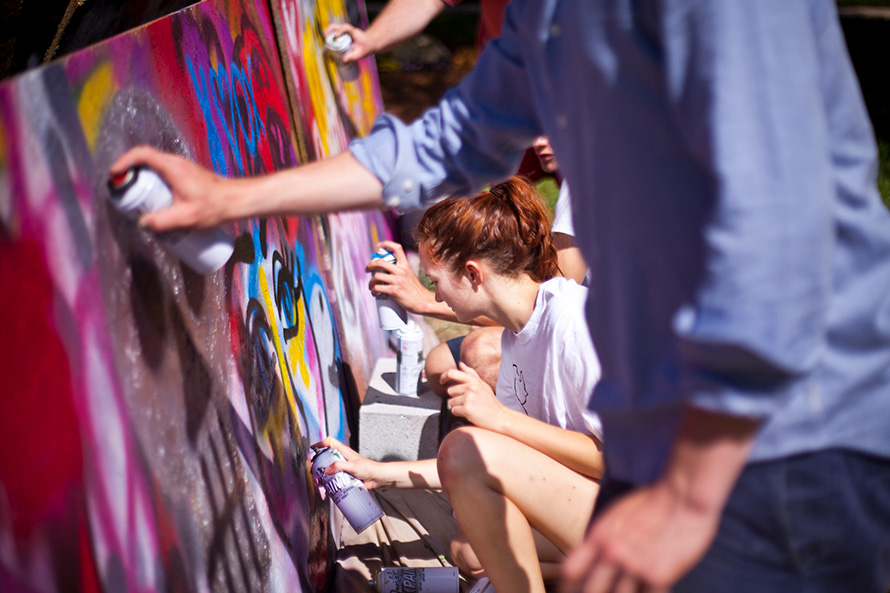students painting a mural