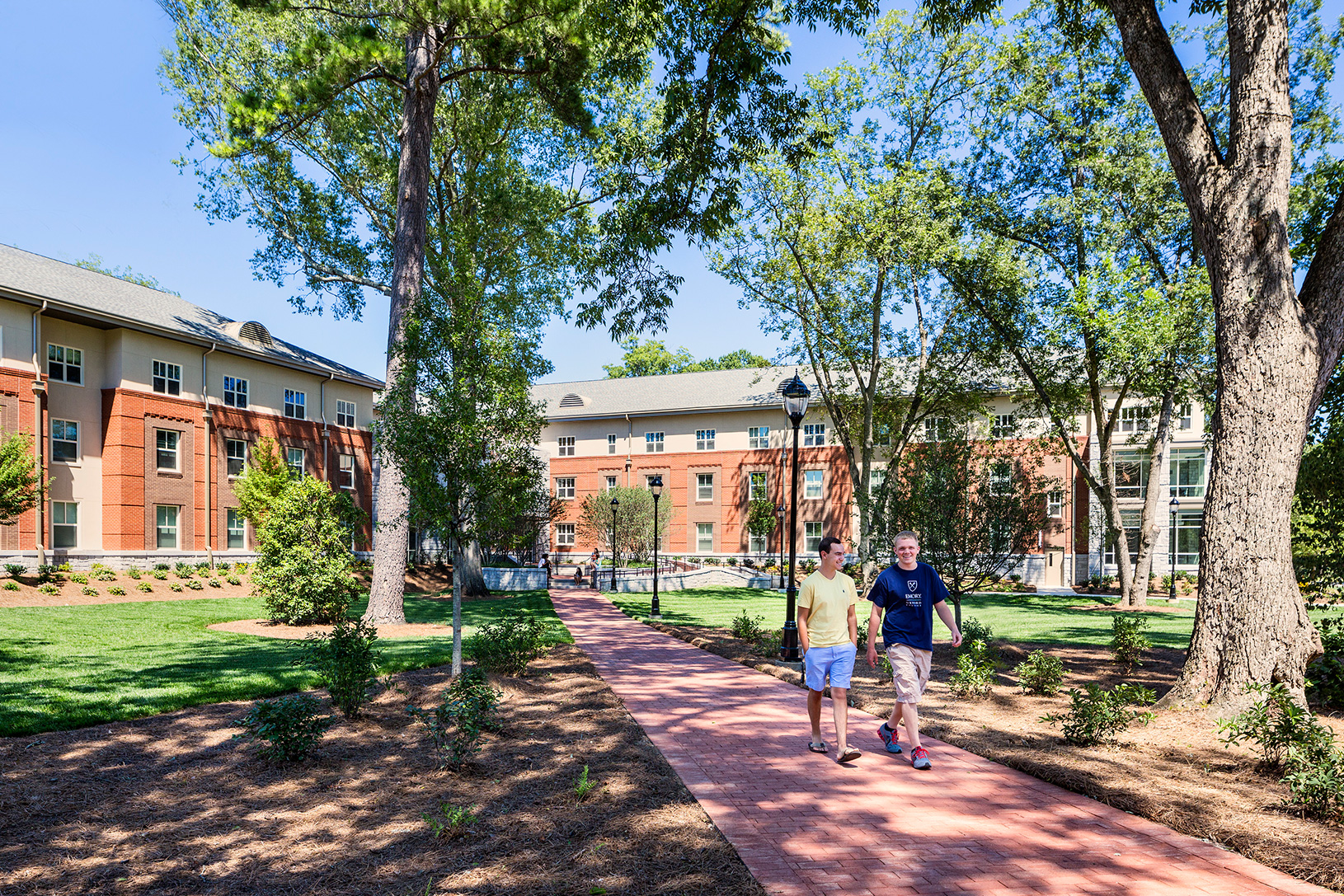 two men walk on Oxford's campus