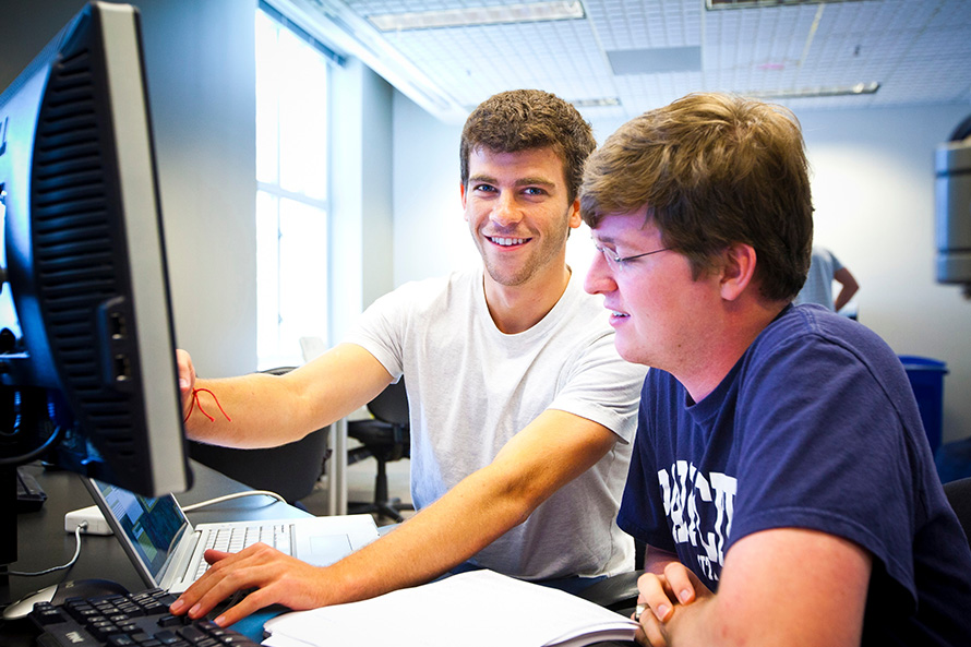 Two male students at computer